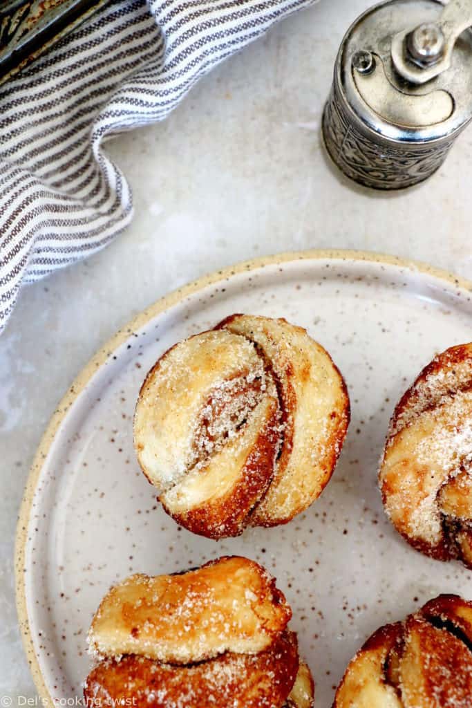 This easy cinnamon cardamom muffins recipe is a cross between a croissant and a muffin. In this easy version, the croissant dough is replaced with puff pastry, filled with cinnamon and coated in a cardamon-sugar mixture.