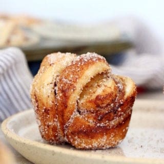 This easy cinnamon cardamom muffins recipe is a cross between a croissant and a muffin. In this easy version, the croissant dough is replaced with puff pastry, filled with cinnamon and coated in a cardamon-sugar mixture.