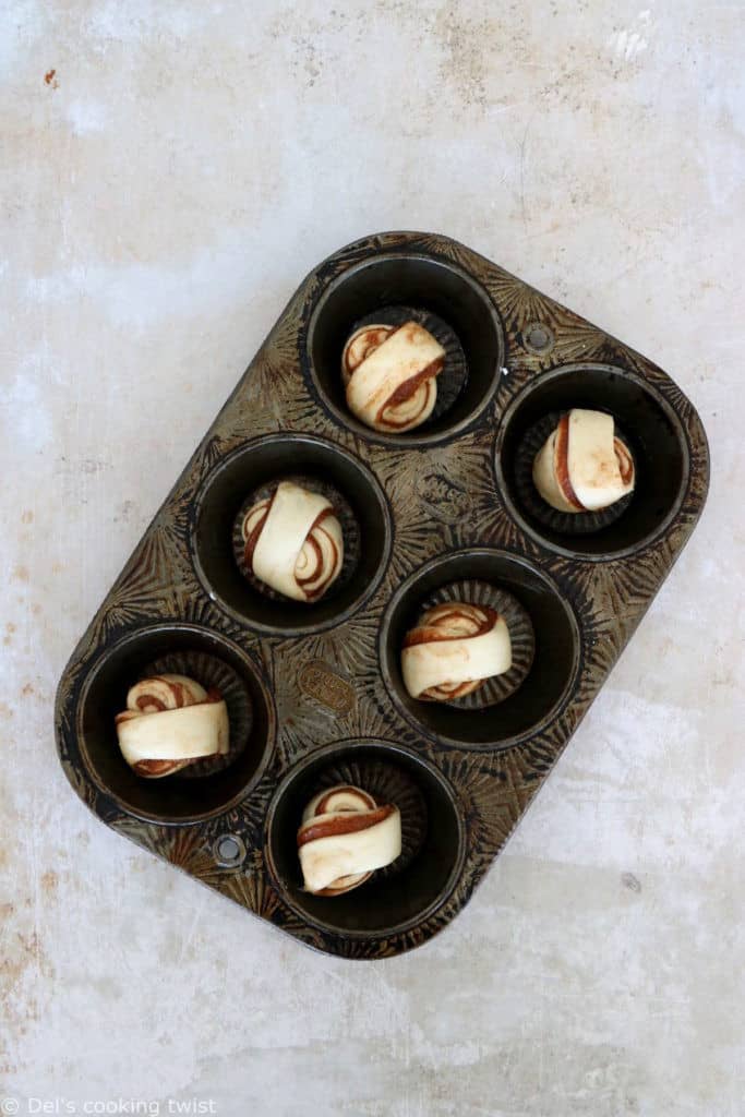 This easy cinnamon cardamom muffins recipe is a cross between a croissant and a muffin. In this easy version, the croissant dough is replaced with puff pastry, filled with cinnamon and coated in a cardamon-sugar mixture.