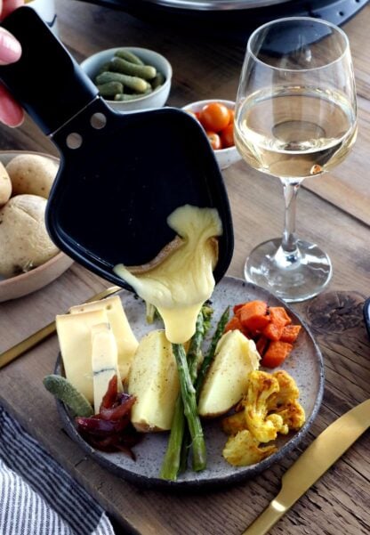 Learn how to host a vegetarian raclette dinner party at home, with veggie suggestions and how to prepare them, playing with spices and other add-ons to make it a feast!