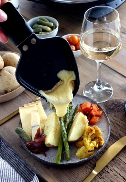 Learn how to host a vegetarian raclette dinner party at home, with veggie suggestions and how to prepare them, playing with spices and other add-ons to make it a feast!