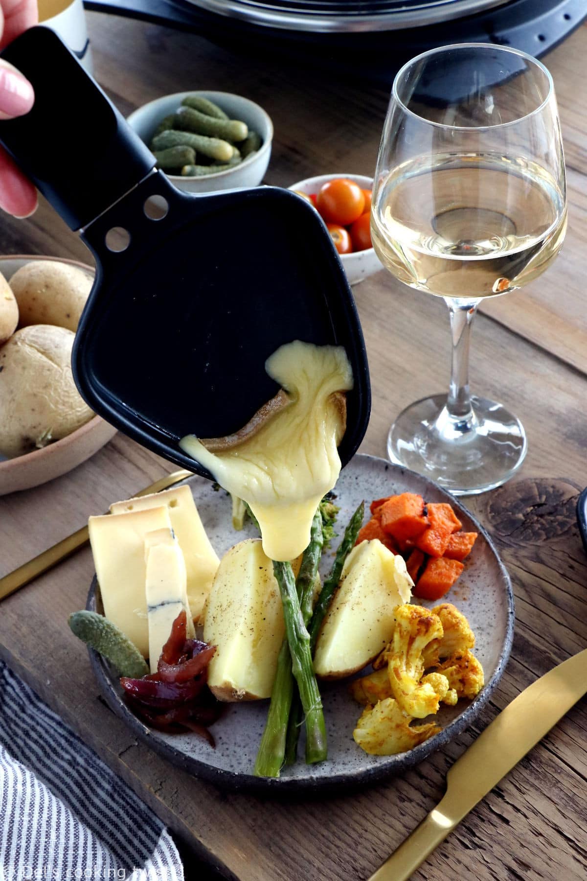 Learn how to host a vegetarian raclette dinner party at home, with veggie suggestions and how to prepare them, playing with spices and other add-ons to make it a feast!