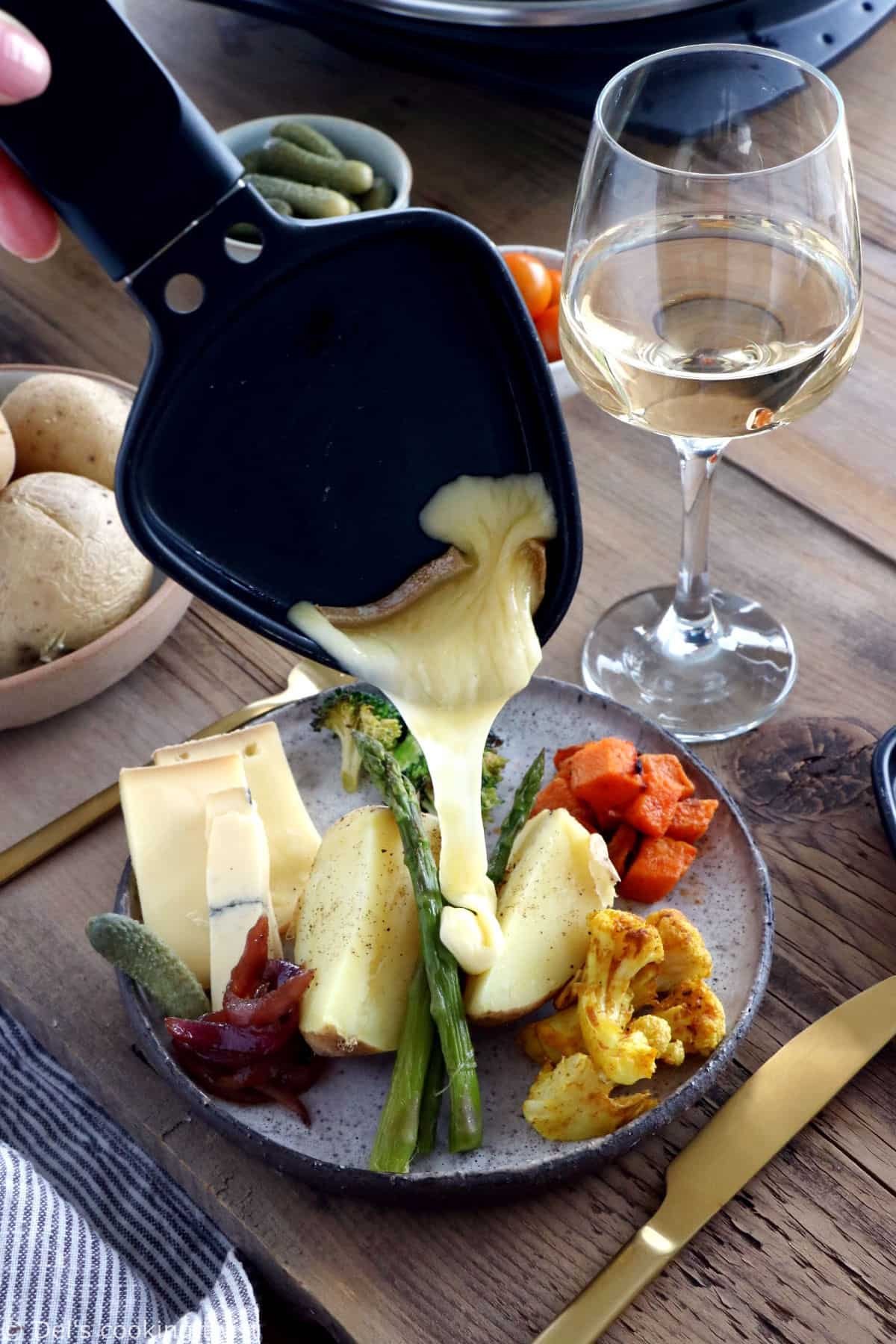 Learn how to host a vegetarian raclette dinner party at home, with veggie suggestions and how to prepare them, playing with spices and other add-ons to make it a feast!