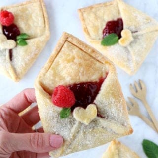 These adorable raspberry pie pastry envelopes are mini pies folded like an envelope, and filled with a delicious raspberry jam.
