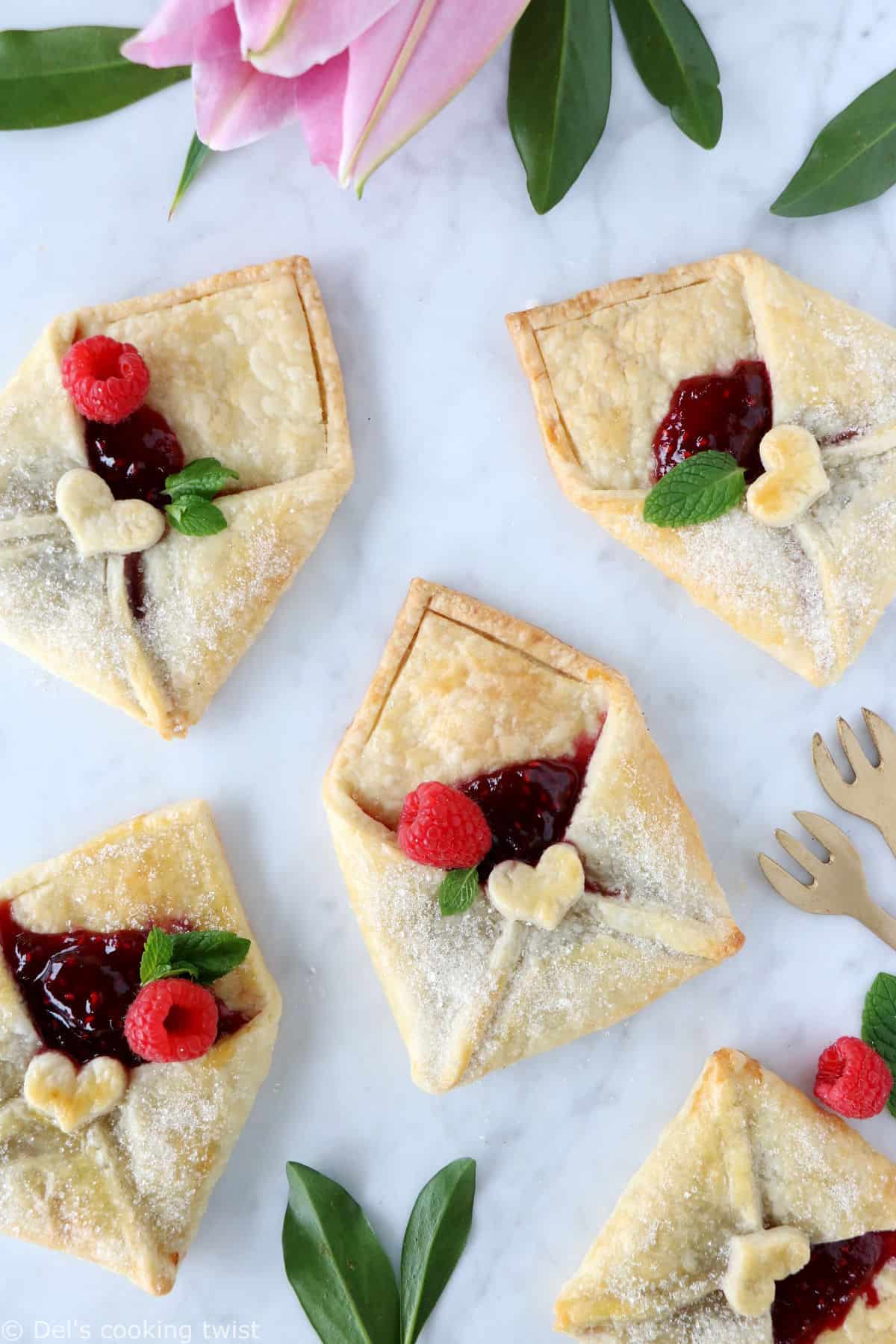 These adorable raspberry pie pastry envelopes are mini pies folded like an envelope, and filled with a delicious raspberry jam.