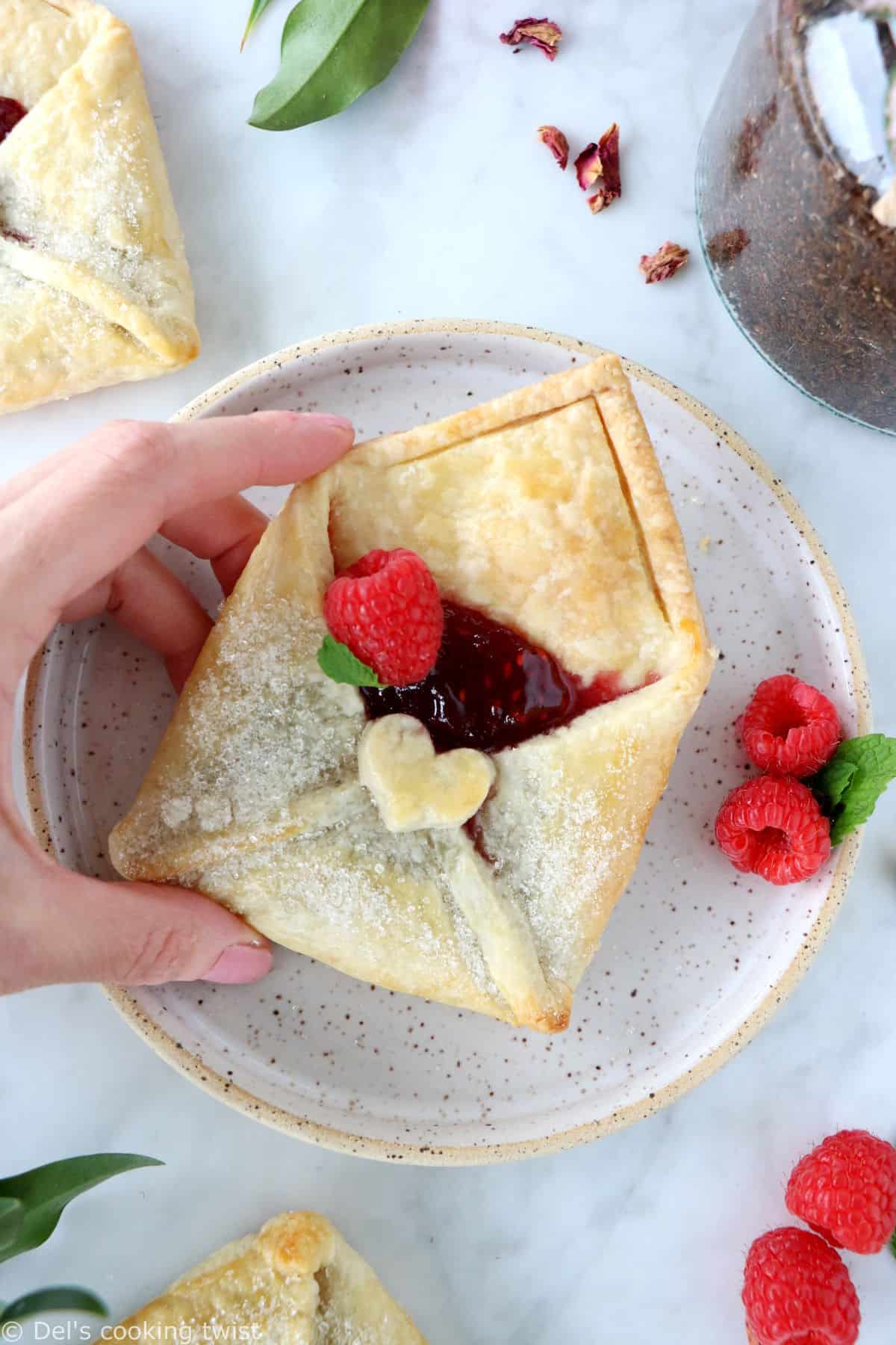 These adorable raspberry pie pastry envelopes are mini pies folded like an envelope, and filled with a delicious raspberry jam.