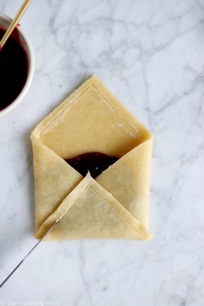 These adorable raspberry pie pastry envelopes are mini pies folded like an envelope, and filled with a delicious raspberry jam.