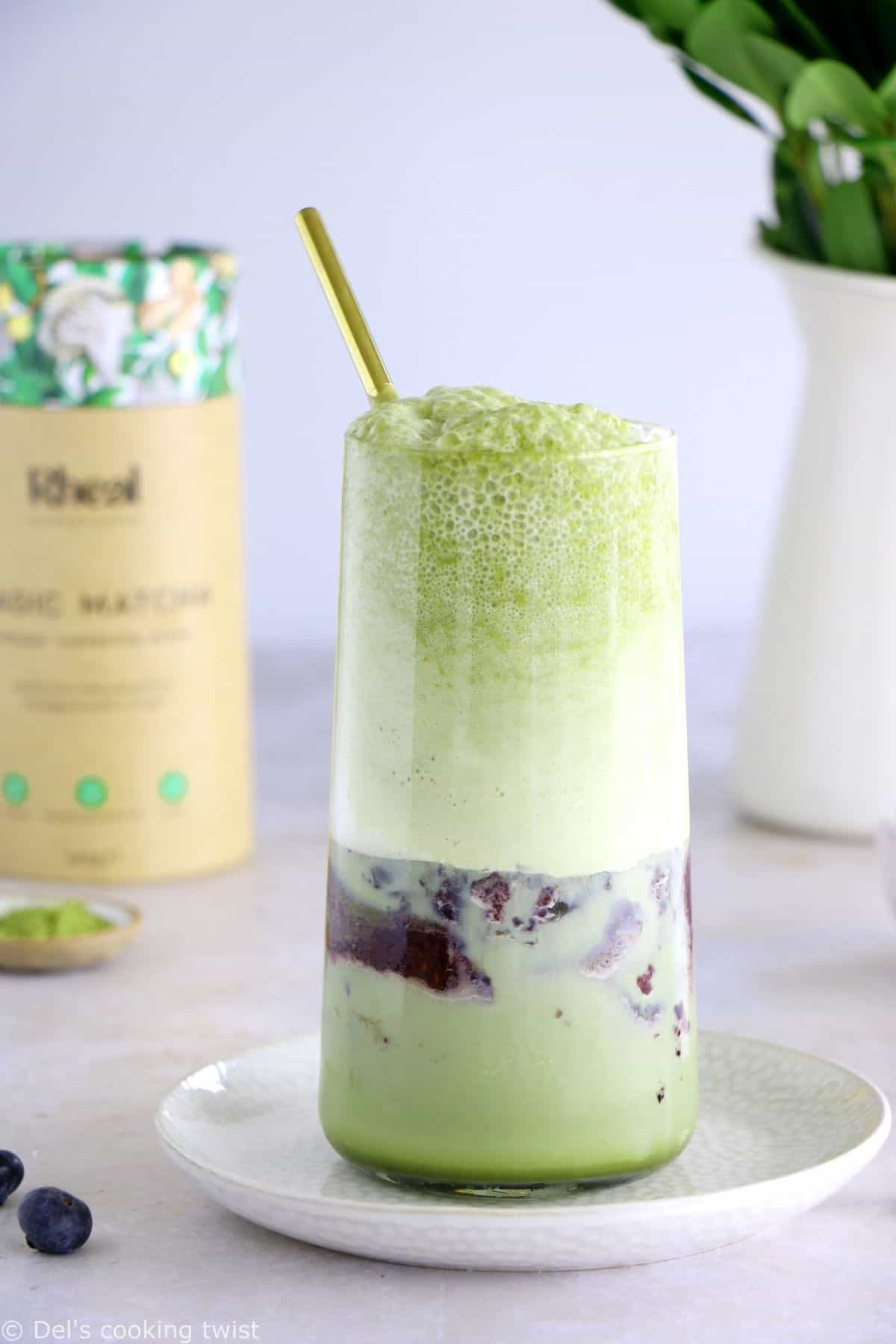 Matcha frappuccino is easy to make in a blender in just a few seconds. This frozen green tea latte is sweet and delicious, and even comes with a blueberry swirl bottom.