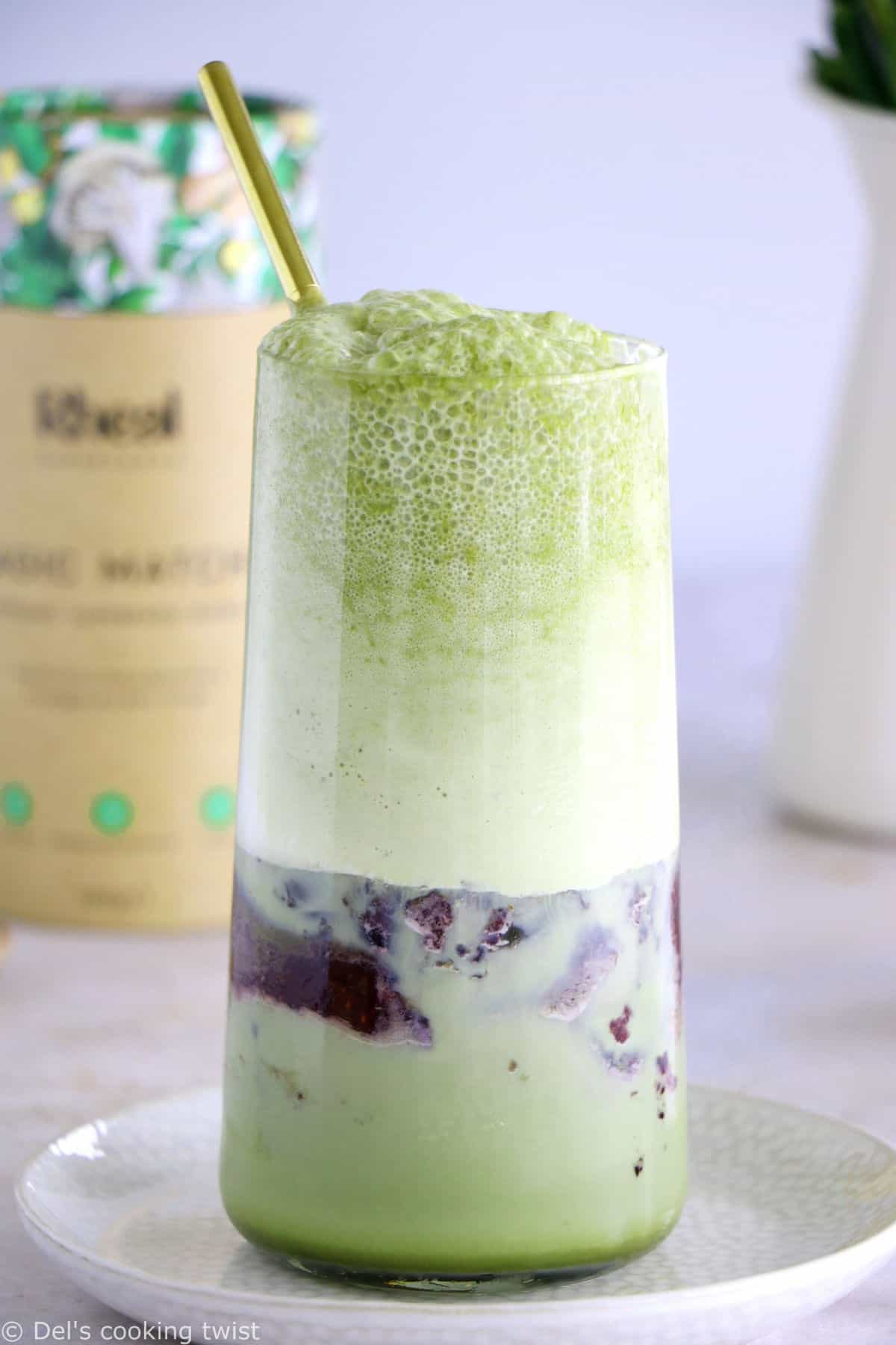 Matcha frappuccino is easy to make in a blender in just a few seconds. This frozen green tea latte is sweet and delicious, and even comes with a blueberry swirl bottom.