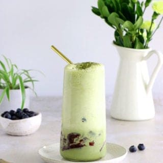 Matcha frappuccino is easy to make in a blender in just a few seconds. This frozen green tea latte is sweet and delicious, and even comes with a blueberry swirl bottom.