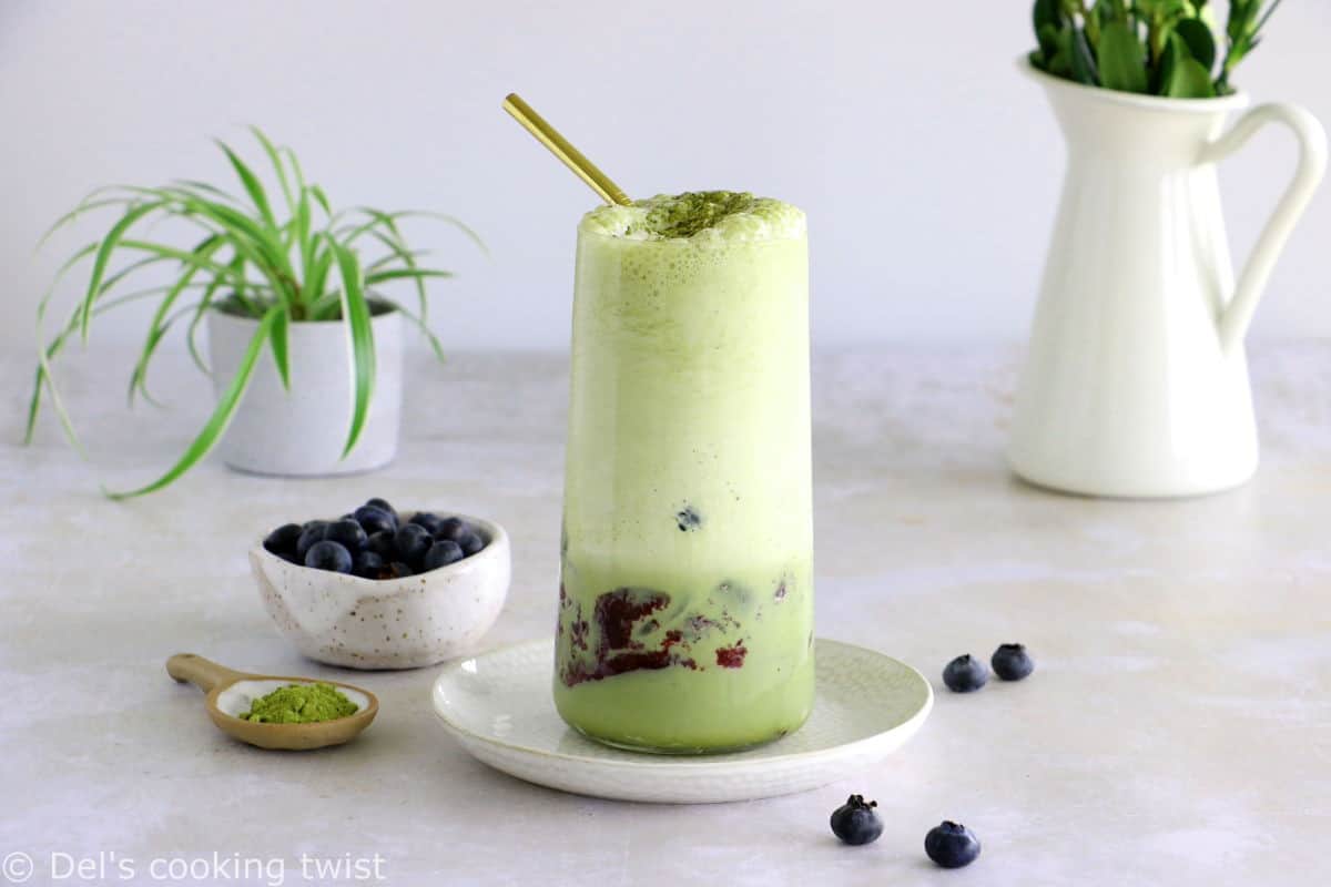 Matcha frappuccino is easy to make in a blender in just a few seconds. This frozen green tea latte is sweet and delicious, and even comes with a blueberry swirl bottom.