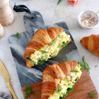 Scrambled egg croissant breakfast sandwiches are filled with avocado, goat cheese scrambled eggs and baby spinach. A great lazy breakfast.