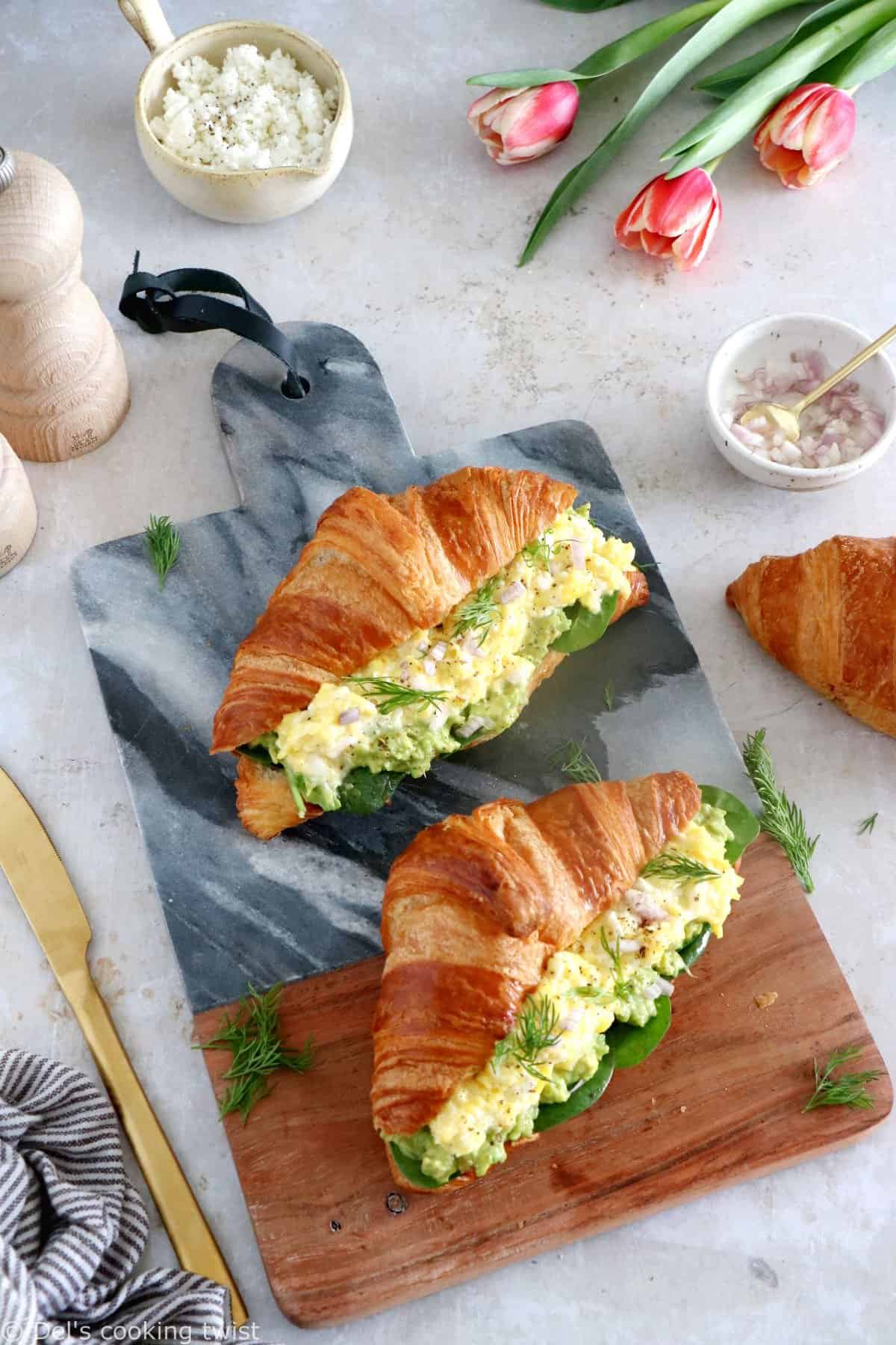 Scrambled egg croissant breakfast sandwiches are filled with avocado, goat cheese scrambled eggs and baby spinach. A great lazy breakfast.