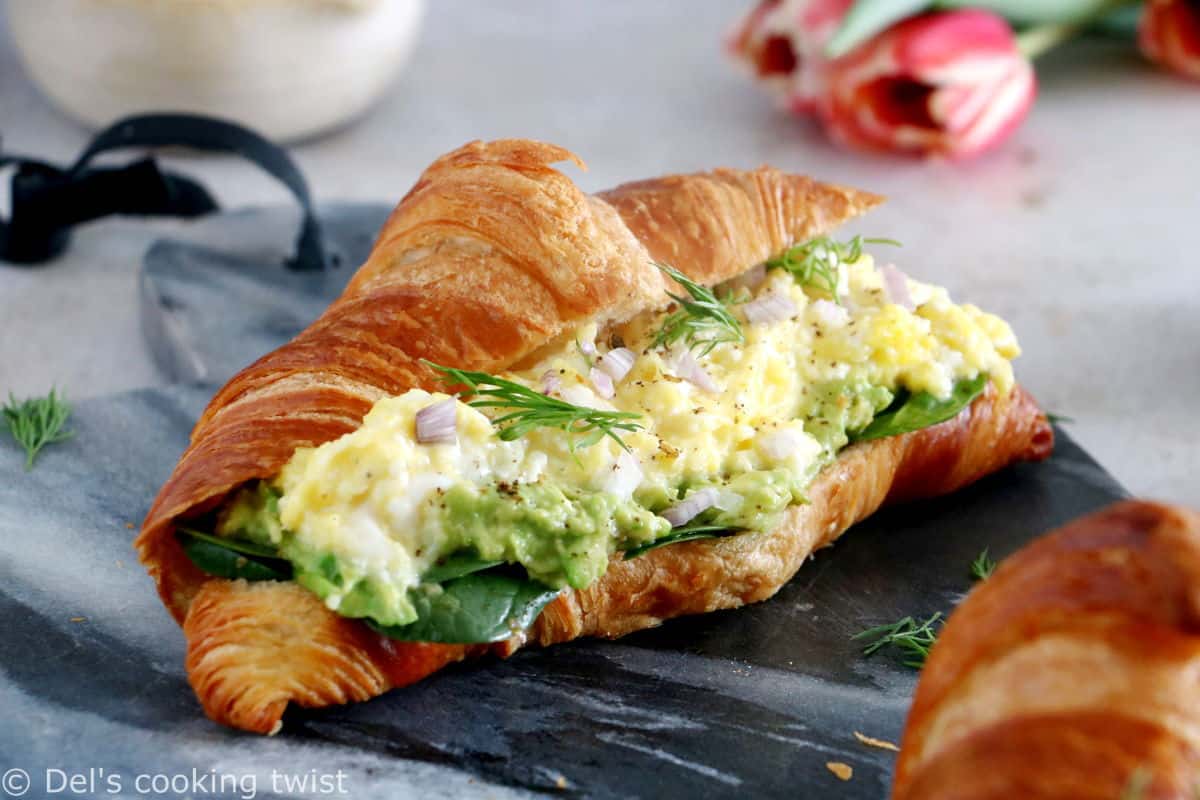 Scrambled egg croissant breakfast sandwiches are filled with avocado, goat cheese scrambled eggs and baby spinach. A great lazy breakfast.