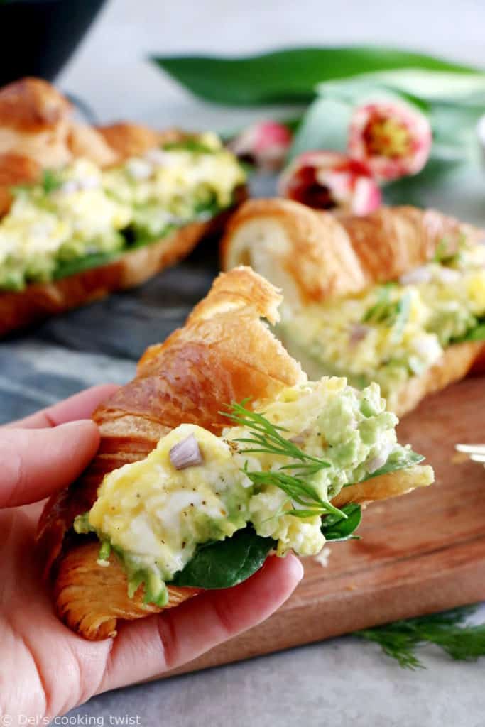 Scrambled egg croissant breakfast sandwiches are filled with avocado, goat cheese scrambled eggs and baby spinach. A great lazy breakfast.