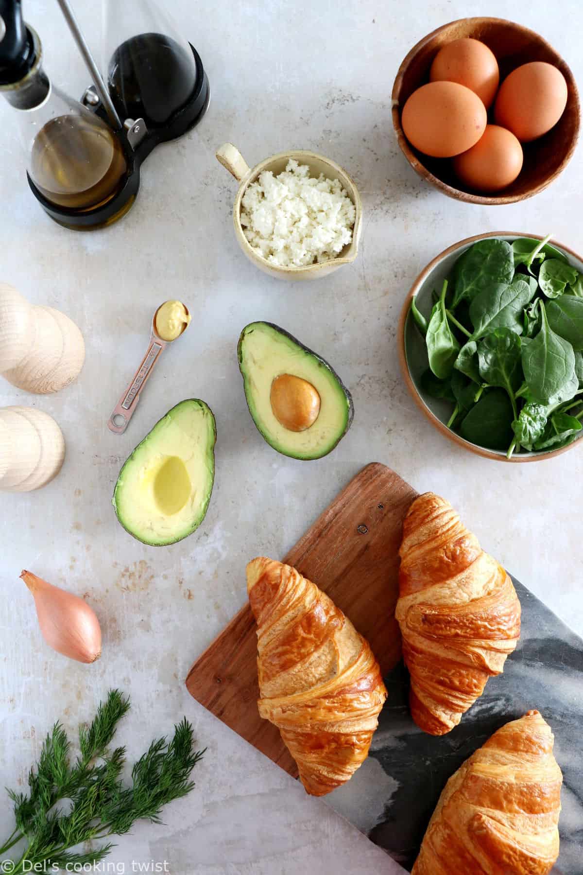 Scrambled egg croissant breakfast sandwiches are filled with avocado, goat cheese scrambled eggs and baby spinach. A great lazy breakfast.