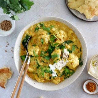 This roasted cauliflower dal is a comforting and satisfying Indian stew, prepared with red lentils, coconut milk, and golden roasted cauliflower.