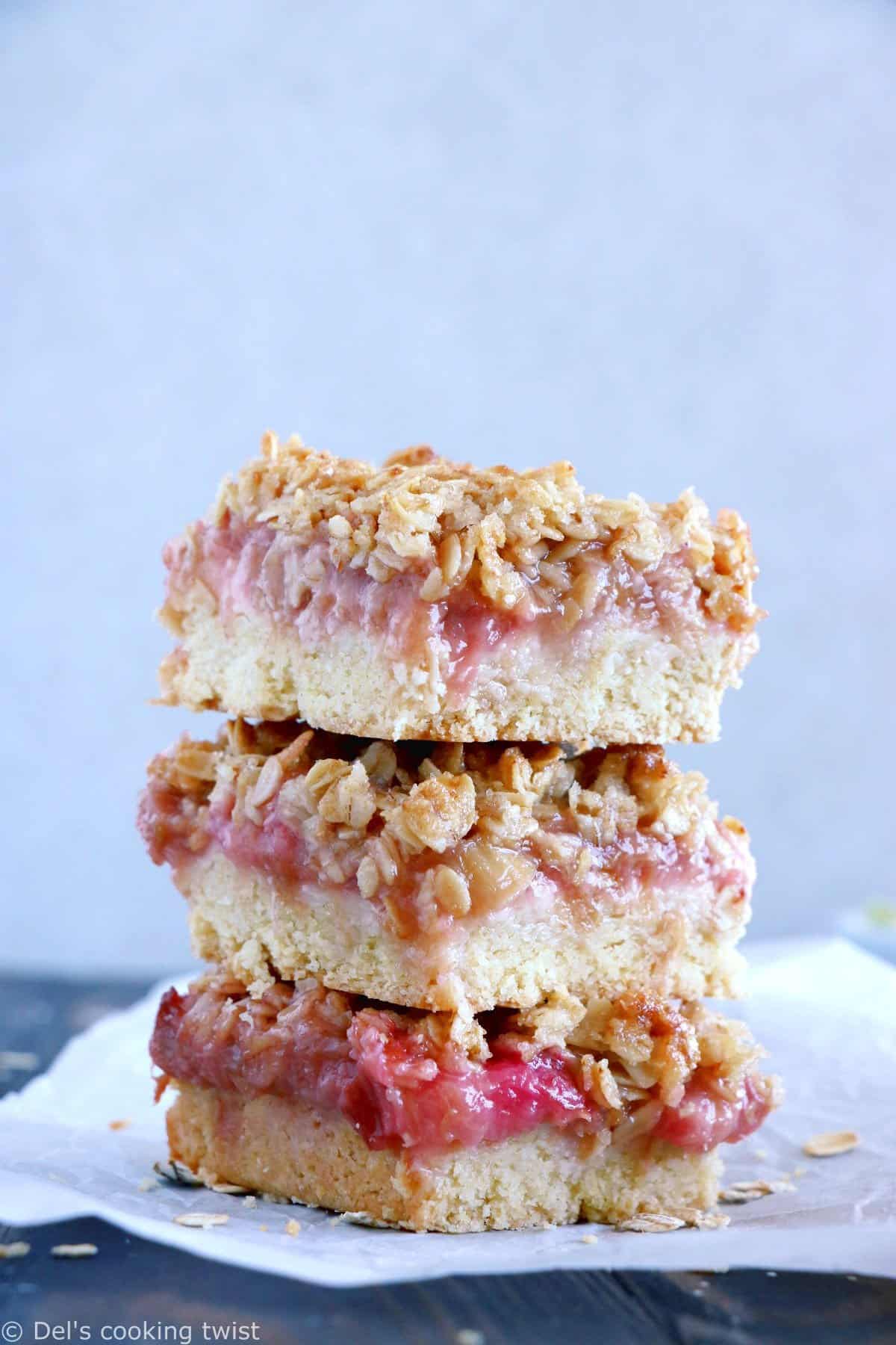 Rhubarb Crumble Bars are a must bake summer dessert recipe. They feature a thick and generous base, a juicy, sweet and tart rhubarb compote, and a crispy oat crumble on top.