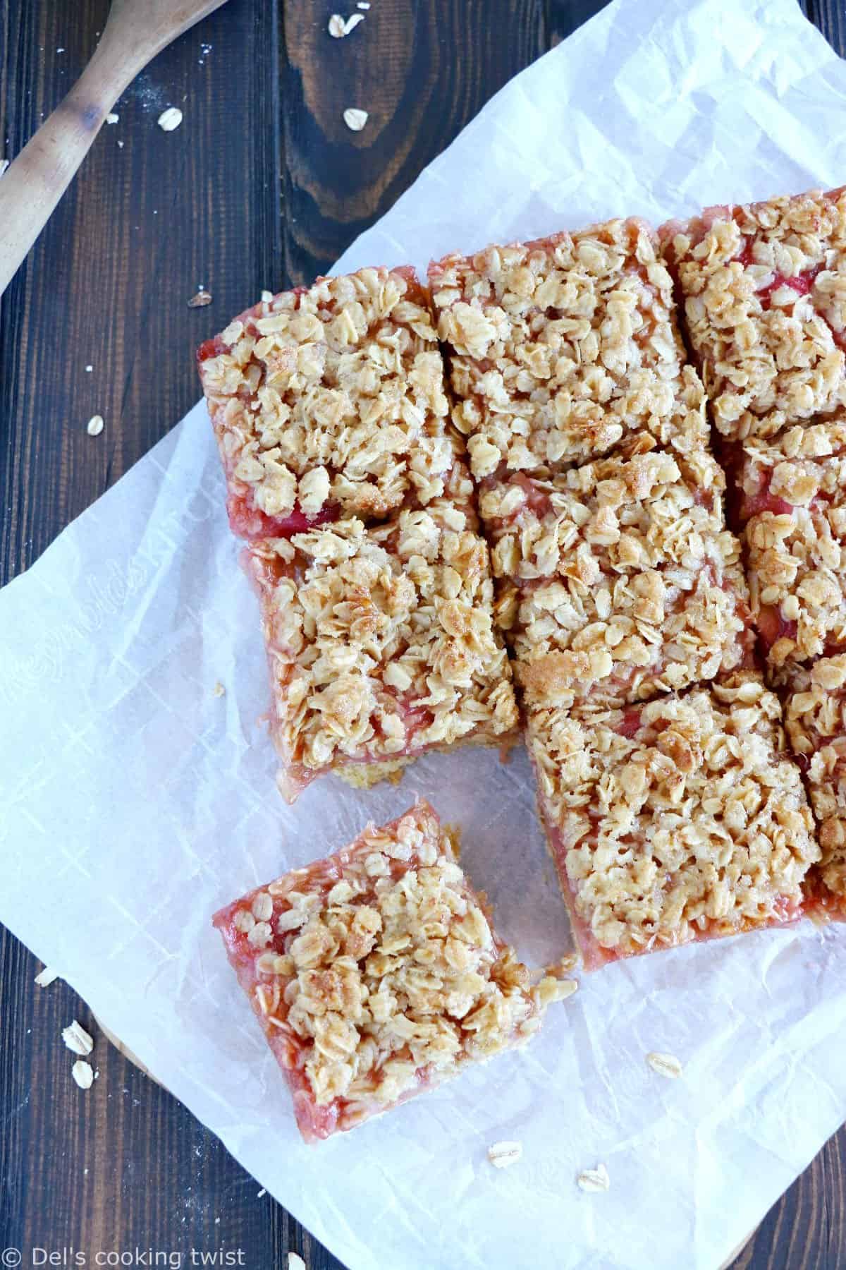 Rhubarb Crumble Bars are a must bake summer dessert recipe. They feature a thick and generous base, a juicy, sweet and tart rhubarb compote, and a crispy oat crumble on top.