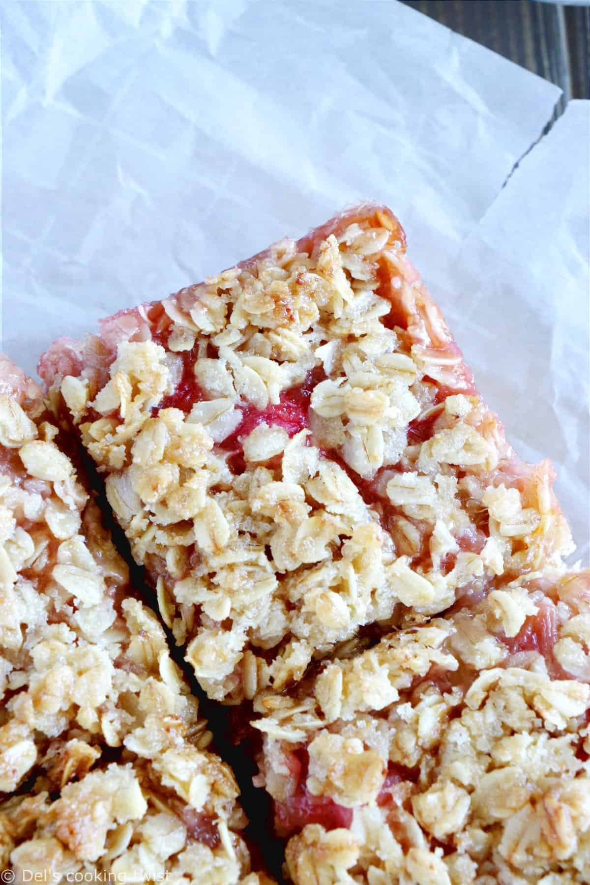 Rhubarb Crumble Bars are a must bake summer dessert recipe. They feature a thick and generous base, a juicy, sweet and tart rhubarb compote, and a crispy oat crumble on top.