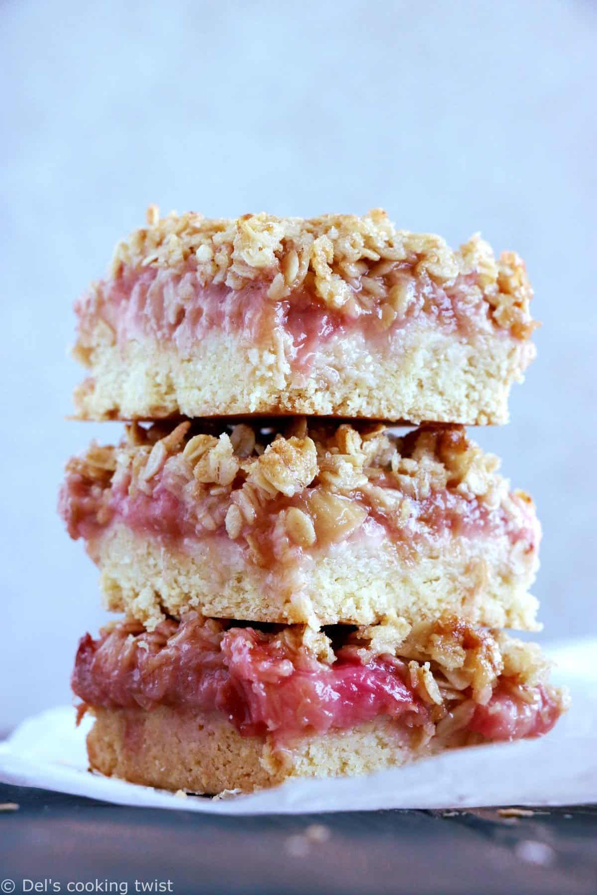 Rhubarb Crumble Bars are a must bake summer dessert recipe. They feature a thick and generous base, a juicy, sweet and tart rhubarb compote, and a crispy oat crumble on top.