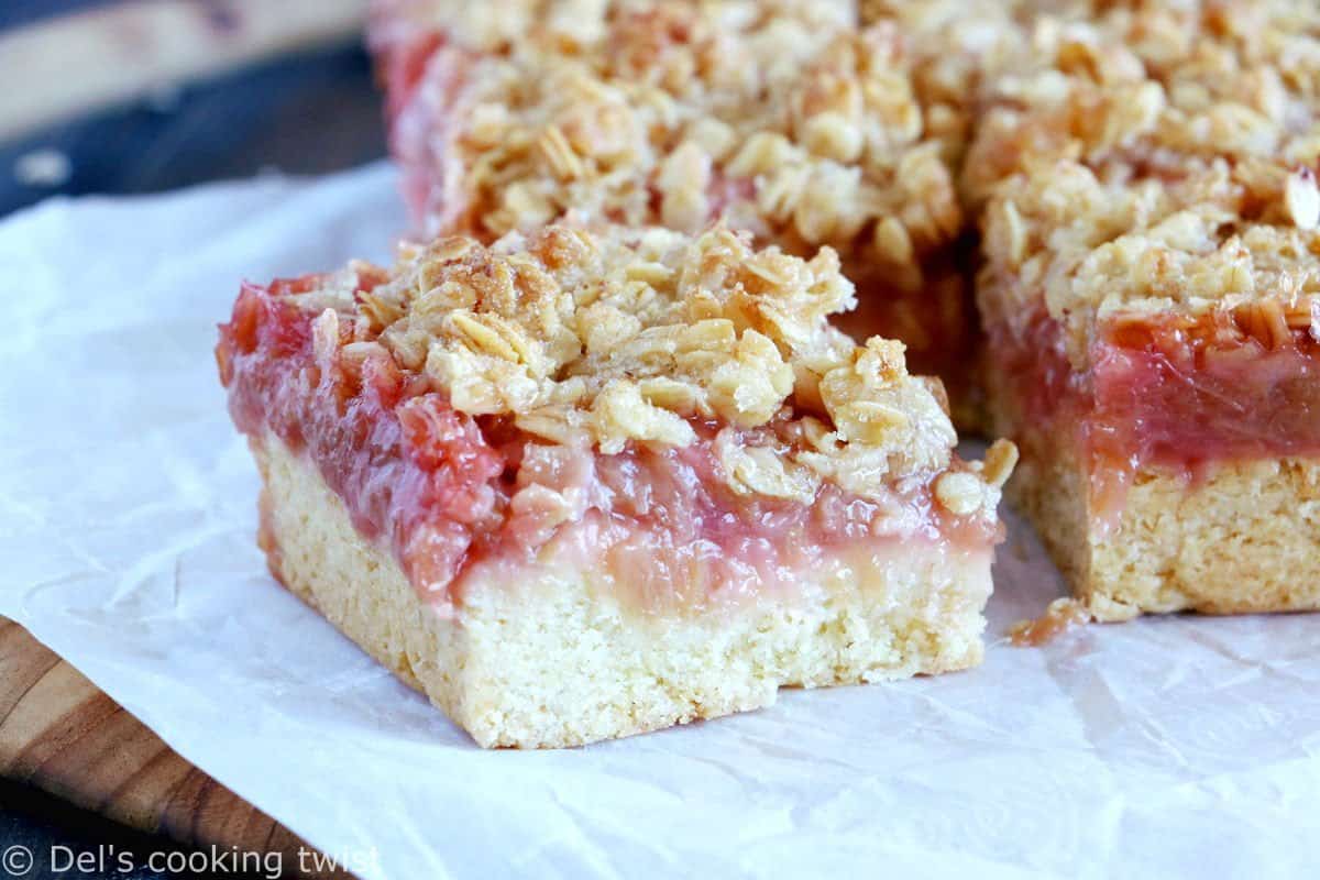 Rhubarb Crumble Bars are a must bake summer dessert recipe. They feature a thick and generous base, a juicy, sweet and tart rhubarb compote, and a crispy oat crumble on top.