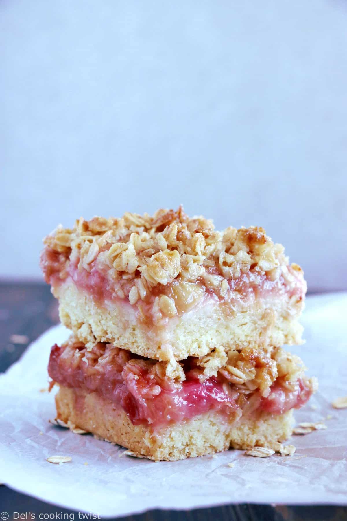Rhubarb Crumble Bars are a must bake summer dessert recipe. They feature a thick and generous base, a juicy, sweet and tart rhubarb compote, and a crispy oat crumble on top.