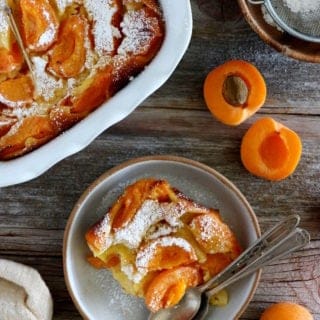 Apricot clafoutis is a timeless French dessert, consisting of a simple creamy custard base filled with fresh apricots.