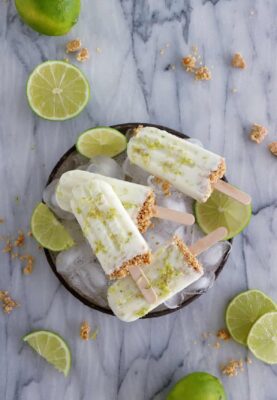 These key lime pie popsicles make the best refreshing summer treat. Quick and super easy to make with 3 main ingredients, they are lightly sweetened and also available in a gluten-free version.