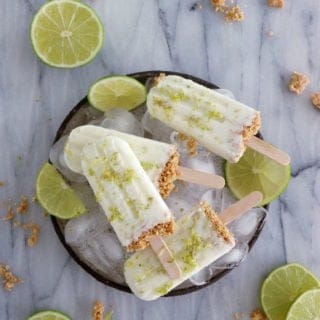 These key lime pie popsicles make the best refreshing summer treat. Quick and super easy to make with 3 main ingredients, they are lightly sweetened and also available in a gluten-free version.