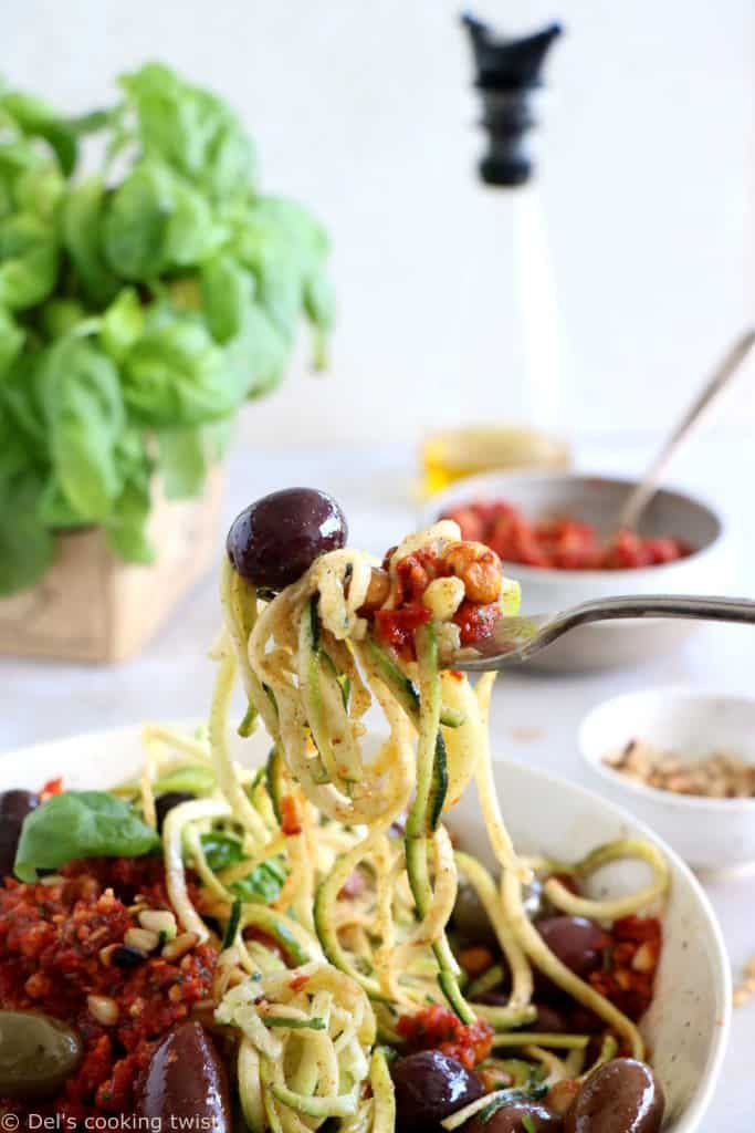 These Mediterranean chickpea zoodles burst with summer flavors. Both vegan and gluten-free, this healthy dish features some zucchini noodles, olives and roasted chickpeas, tossed in a delicious homemade sun-dried tomato sauce.