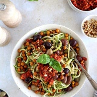 These Mediterranean chickpea zoodles burst with summer flavors. Both vegan and gluten-free, this healthy dish features some zucchini noodles, olives and roasted chickpeas, tossed in a delicious homemade sun-dried tomato sauce.