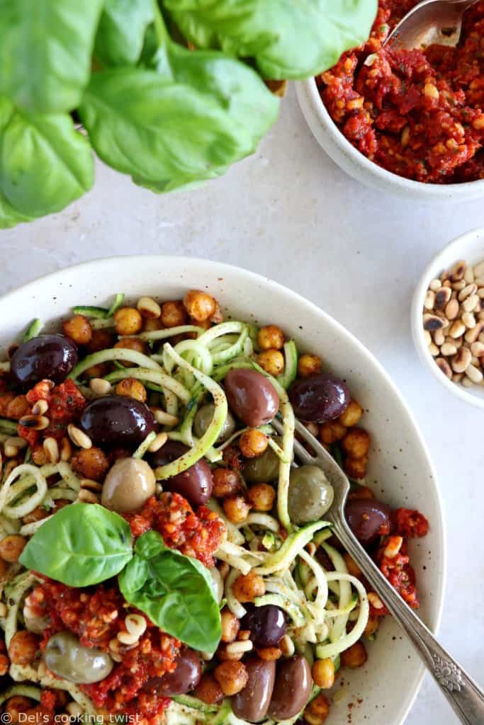 These Mediterranean chickpea zoodles burst with summer flavors. Both vegan and gluten-free, this healthy dish features some zucchini noodles, olives and roasted chickpeas, tossed in a delicious homemade sun-dried tomato sauce.