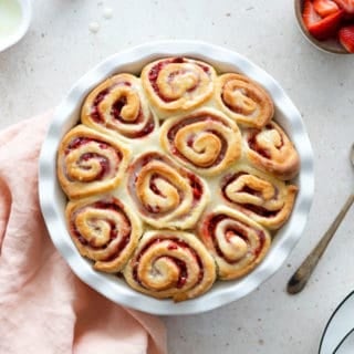 Perfect for weekend breakfast, these sweet strawberry rolls topped with a subtle lemon glaze are soft, pillowy, and beaming with strawberry flavor.