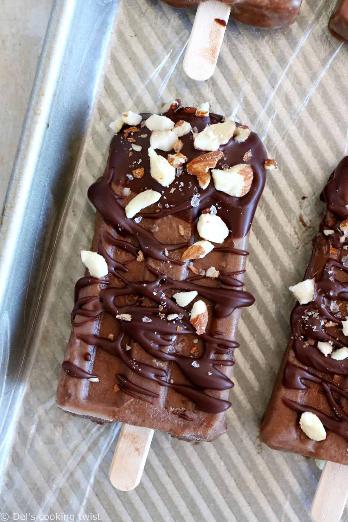 Chocolate almond butter banana popsicles make a decadent summer treat. Both rich and fudgy, they're entirely vegan and prepared with nutritious, natural ingredients. The perfect healthy snack on a stick.