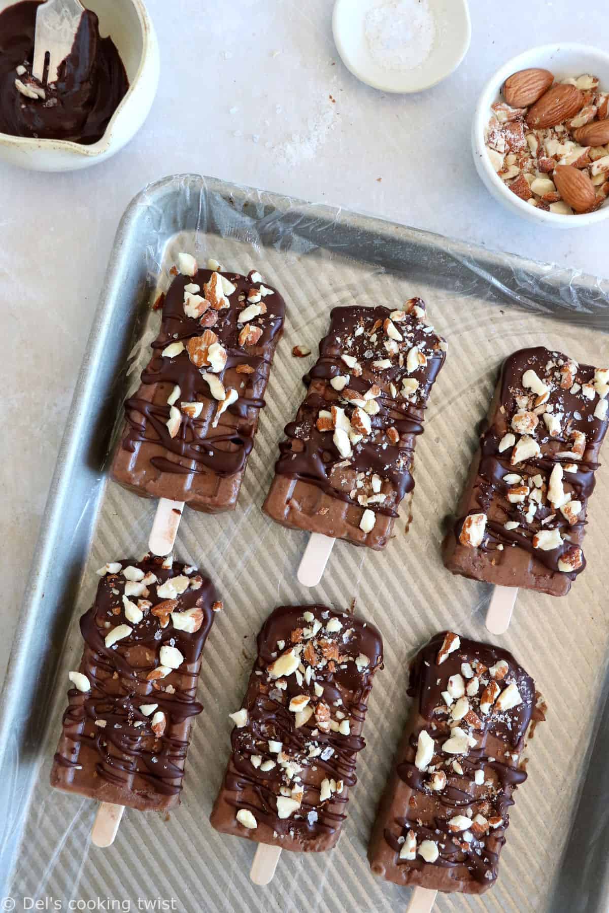 Chocolate almond butter banana popsicles make a decadent summer treat. Both rich and fudgy, they're entirely vegan and prepared with nutritious, natural ingredients. The perfect healthy snack on a stick.