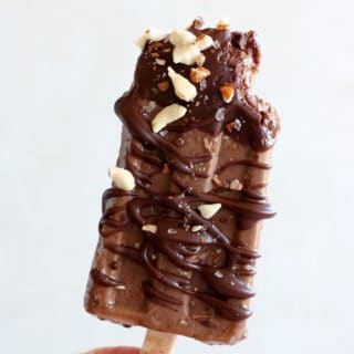 Chocolate almond butter banana popsicles make a decadent summer treat. Both rich and fudgy, they're entirely vegan and prepared with nutritious, natural ingredients. The perfect healthy snack on a stick.