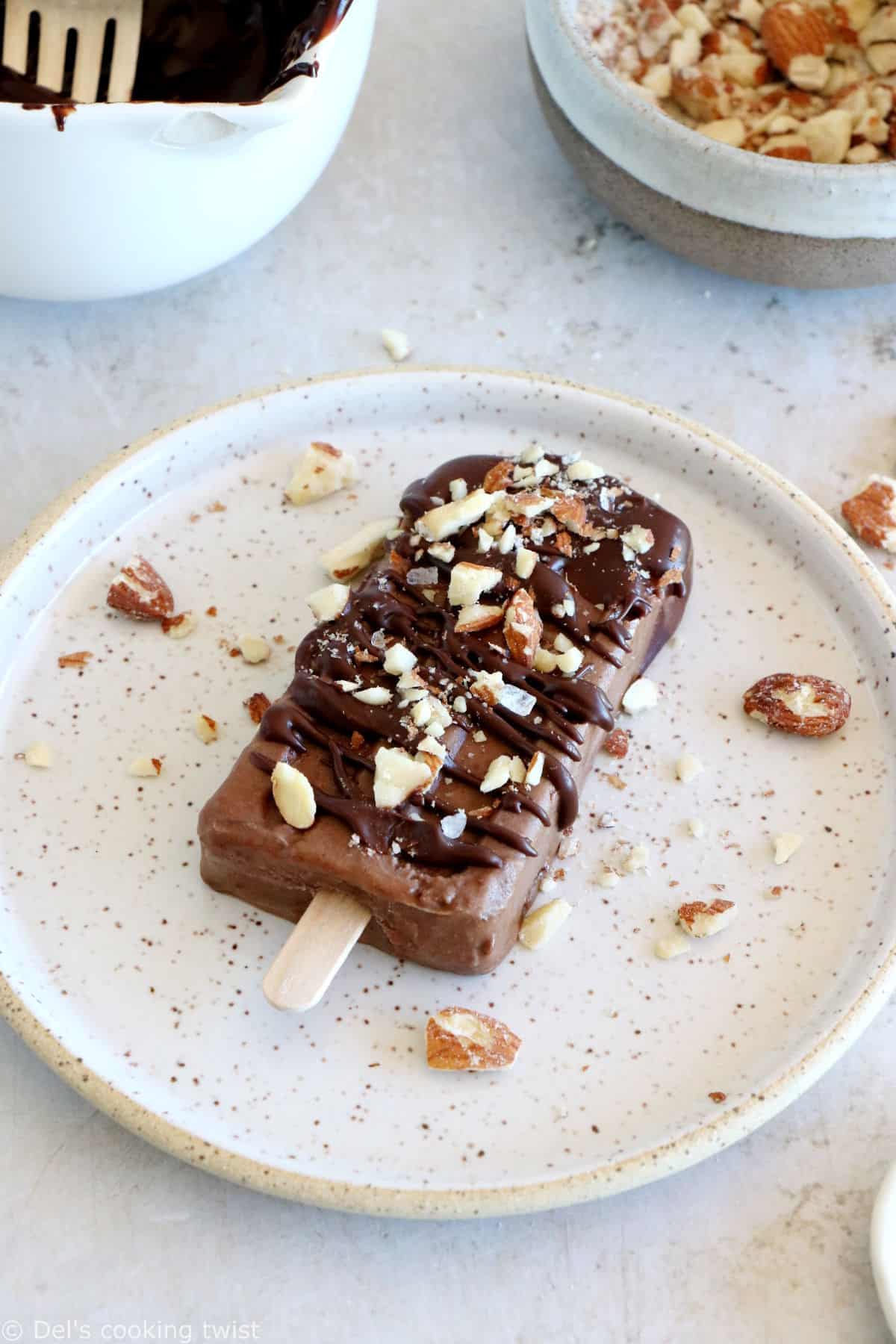 Chocolate almond butter banana popsicles make a decadent summer treat. Both rich and fudgy, they're entirely vegan and prepared with nutritious, natural ingredients. The perfect healthy snack on a stick.