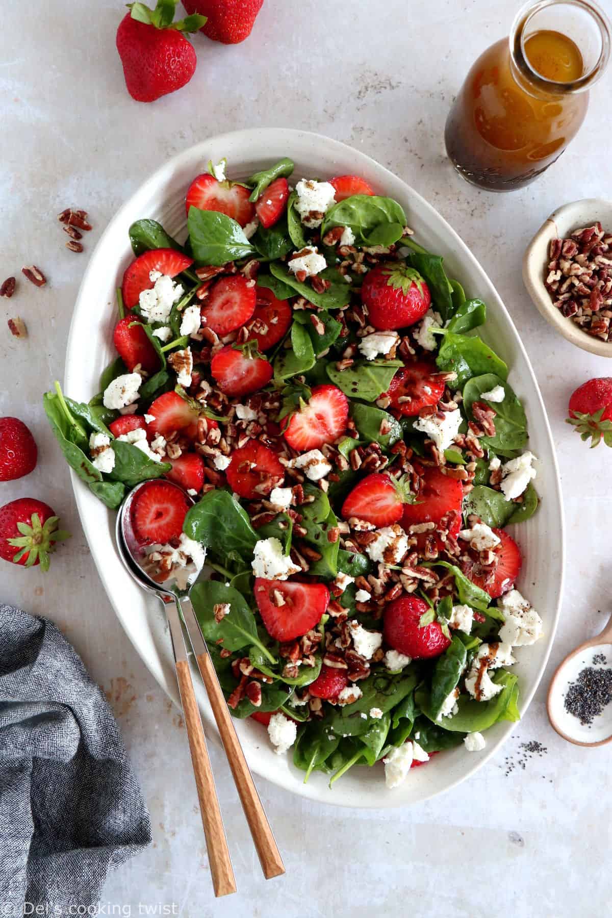 This strawberry spinach salad with goat cheese is tossed in a flavorful balsamic poppy seed dressing. A simple summer salad recipe!