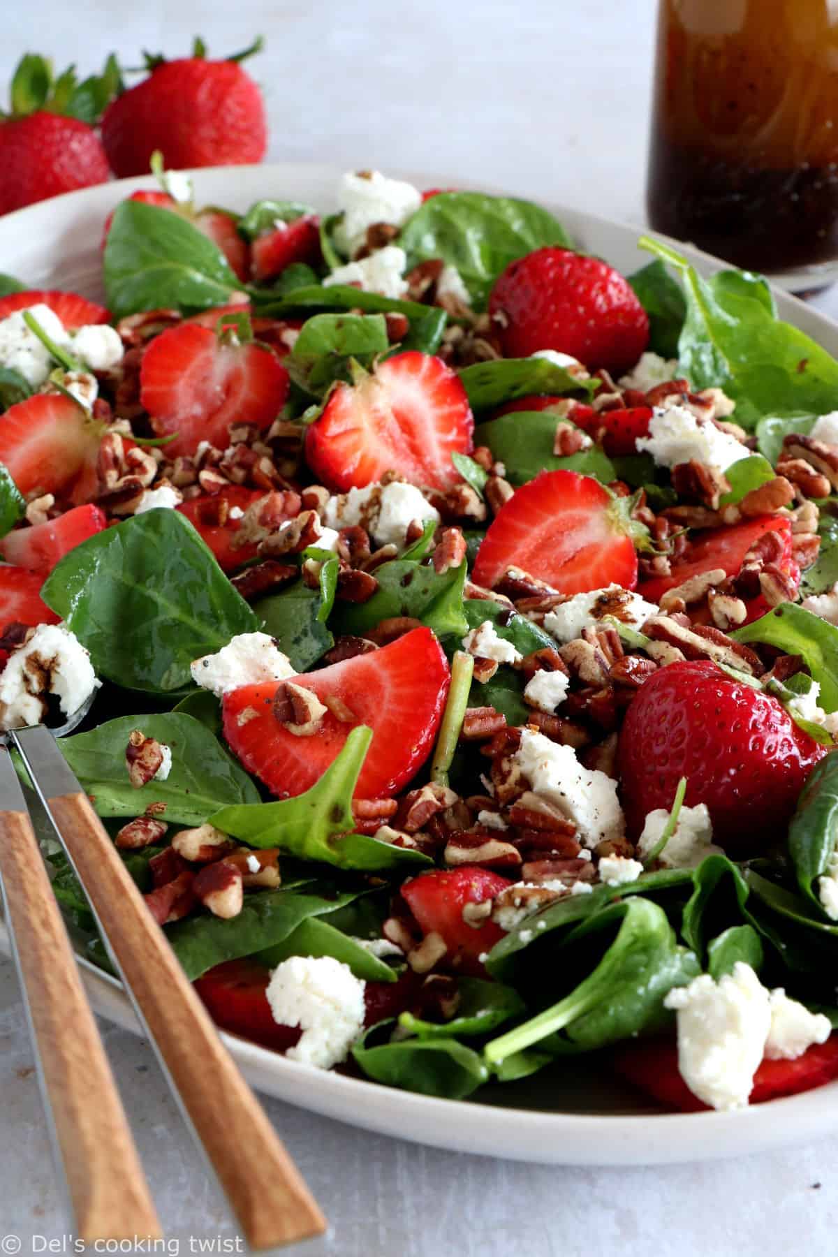 This strawberry spinach salad with goat cheese is tossed in a flavorful balsamic poppy seed dressing. A simple summer salad recipe!