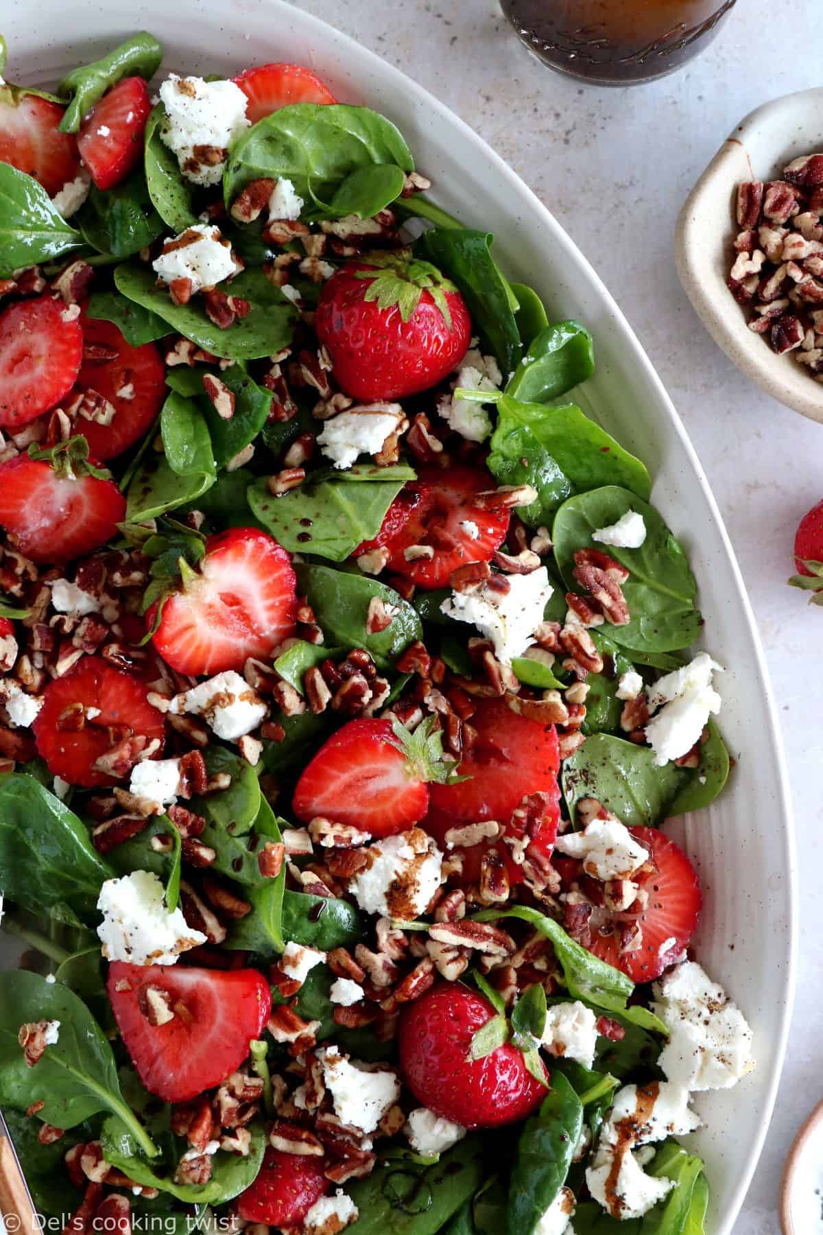 This strawberry spinach salad with goat cheese is tossed in a flavorful balsamic poppy seed dressing. A simple summer salad recipe!