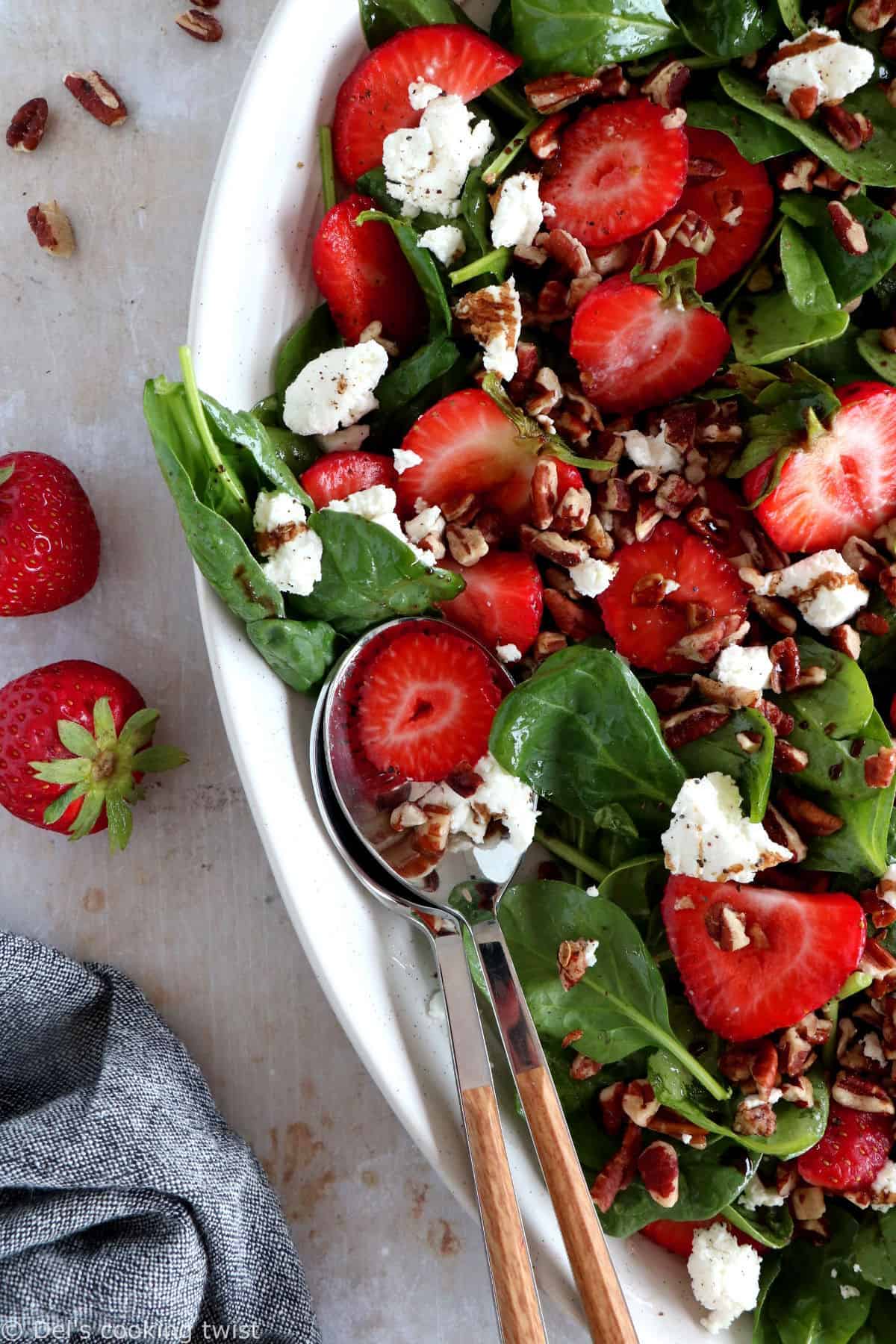 This strawberry spinach salad with goat cheese is tossed in a flavorful balsamic poppy seed dressing. A simple summer salad recipe!