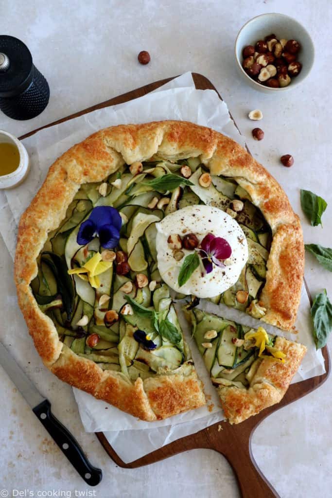 This beautiful zucchini galette is prepared with honey zucchini ribbons, toasted hazelnuts, and some burrata cheese bursting with refreshing flavors.