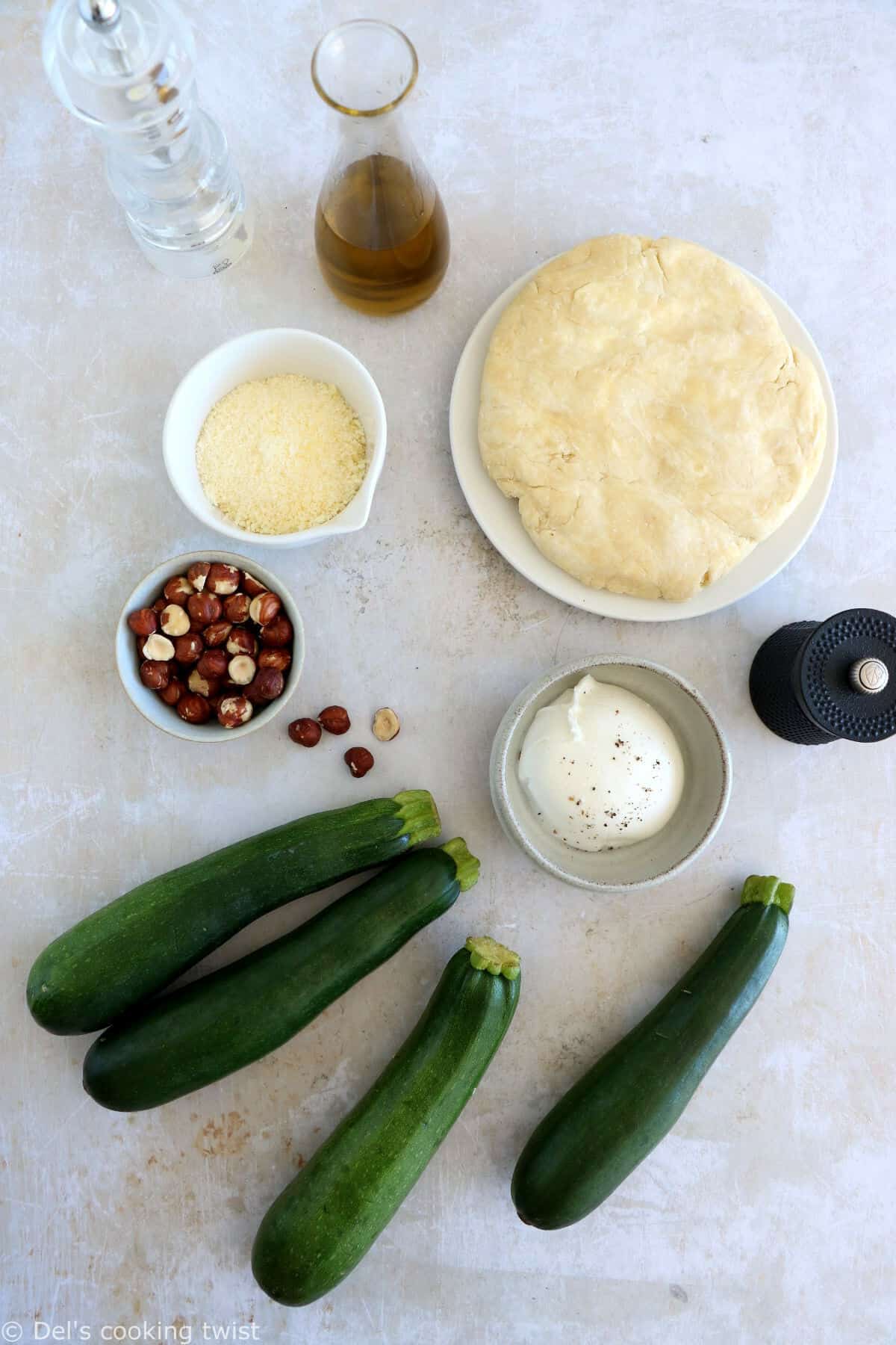 This beautiful zucchini galette is prepared with honey zucchini ribbons, toasted hazelnuts, and some burrata cheese bursting with refreshing flavors.