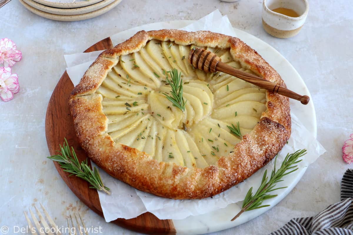 This rosemary honey pear galette is an easy pear tart recipe, featuring an irresistible flaky crust and some juicy pears infused in a rosemary honey syrup.