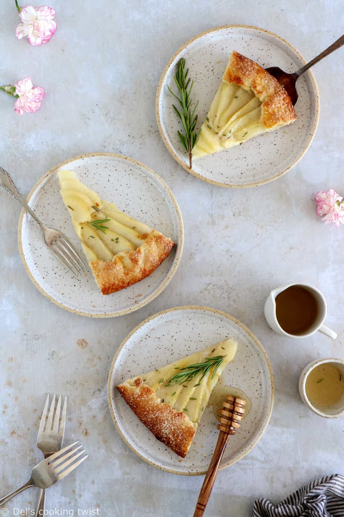 This rosemary honey pear galette is an easy pear tart recipe, featuring an irresistible flaky crust and some juicy pears infused in a rosemary honey syrup.