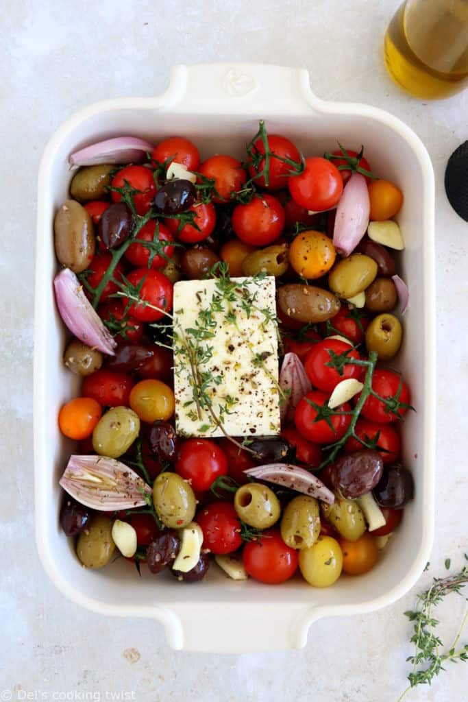 This baked feta with cherry tomatoes and olives, tossed with olive oil, herbs and various seasoning, is bursting with juicy and cheesy flavors.