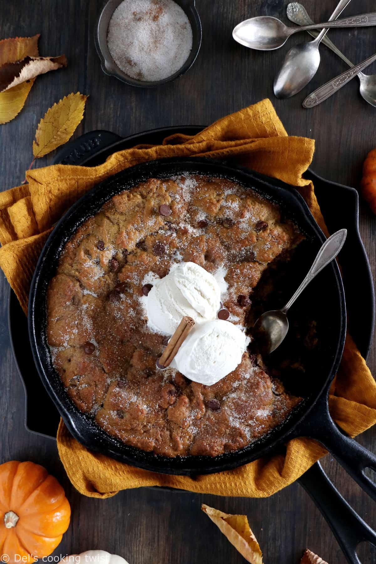 This pumpkin skillet cookie is rich, incredibly fudgy, loaded with chocolate chips and pumpkin spice flavors.