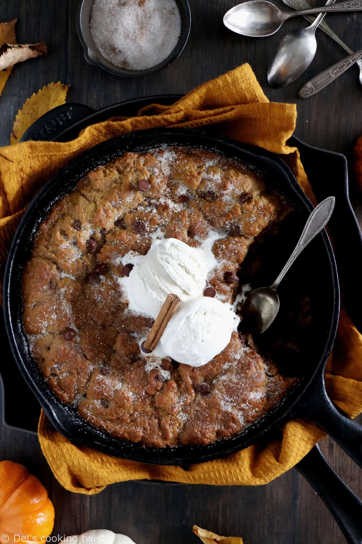 This pumpkin skillet cookie is rich, incredibly fudgy, loaded with chocolate chips and pumpkin spice flavors.