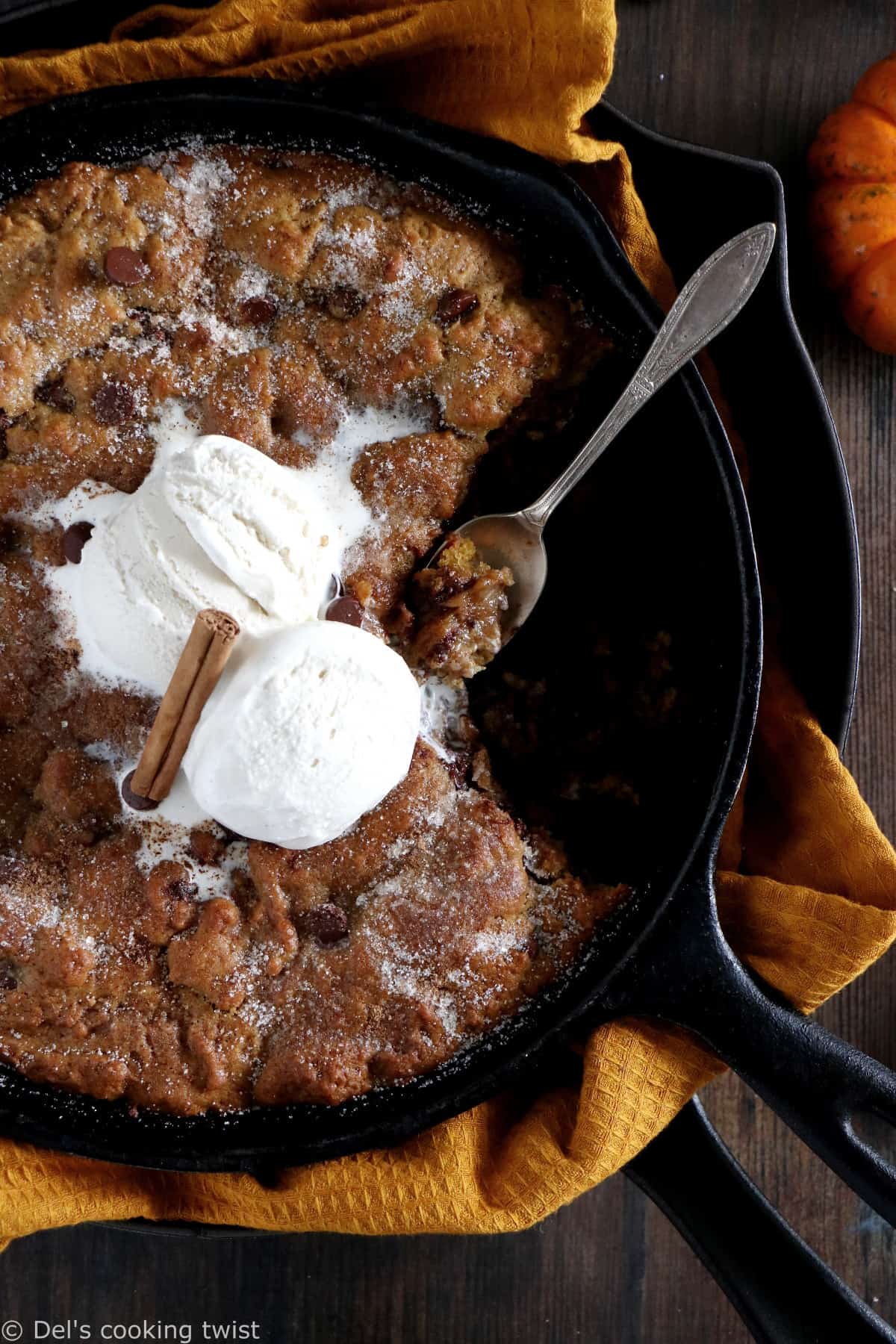 This pumpkin skillet cookie is rich, incredibly fudgy, loaded with chocolate chips and pumpkin spice flavors.